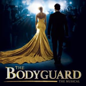 Promotional poster showing a couple walking toward a bright stage; woman in a gold glittery gown with a long train, man in a black suit. The Bodyguard: The Musical title visible at bottom.