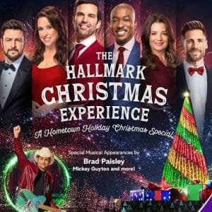Promotional poster for 'The Hallmark Christmas Experience,' a hometown holiday Christmas special, showing six hosts with a festive stage and tree.